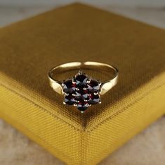 A beautiful genuine antique German silver garnet ring (natural stone), hallmarked '900' for silver, US Size 5 3/4, in good antique condition, would make a nice gift for someone special! Material: 900 silver, garnet Weight: 1.8 g US Size: 5 3/4 (EU 51 1/2) Box on photos is NOT included. PLEASE LOOK AT THE PICTURES, THEY ARE PART OF THE DESCRIPTION AND ARE THE ACTUAL ITEM YOU WILL RECEIVE. Vintage Garnet Ring For Gift, Antique Garnet Rings As Gift, Vintage Red Garnet Cluster Ring, Garnet Filigree Ring, Vintage Garnet Rings With Polished Finish, Memento Mori Ring, Garnet Ring Silver, Citrine Pendant, Red Band