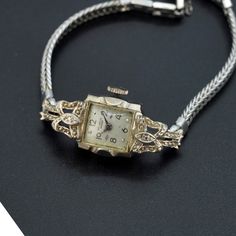 Vintage antique Benrus ladies watch 14k white gold case.  Watch is in working condition. Wind up watch. Fold over clasp with saftey chain. Weighs approx. 14.60 grams This is genuine 14k gold case and 10k gold filled strap. Watch is approx. 15mm in width. There are two diamonds on the case as well. ⭐️⭐️⭐️  MAIN SHOP PAGE ⭐️⭐️⭐️ www.etsy.com/shop/ronnie7 ⭐️⭐️⭐️  ABOUT PAGE ⭐️⭐️⭐️ www.etsy.com/shop/ronnie7/about ⭐️⭐️⭐️  PENDANT SECTION ⭐️⭐️⭐️ www.etsy.com/shop/Ronnie7?section_id=11397068 ⭐️⭐️⭐️ VIN Antique Yellow Gold Watch For Evening, Antique Yellow Gold Watches For Evening, Antique Yellow Gold Evening Watch, Elegant 14k Gold Watches For Evening, Elegant 14k Gold Evening Watches, Elegant Evening 14k Gold Watches, Antique Silver Diamond Watch, Vintage Engraved White Gold Watch, Vintage White Gold Watch Accessories For Formal Occasions