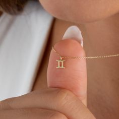 This minimalist Gemini symbol necklace can also be a thoughtful gift for your loved ones born under the sign of Gemini. Its simple design allows it to be worn on a daily basis. Yellow or rose gold options are available. In addition, it's shipped by express shipping like all our products. NECKLACE DETAILS * Material:14 carat solid gold * Weight: 0.90 grams (with 16 inch chain) * Dimensions: 5mm x 5mm * Style: Minimalist * Express shipping worldwide * 100% Handmade * Gift wrapping * Yellow and ros Minimalist Yellow Gold Zodiac Sign Jewelry, Minimalist Yellow Gold Zodiac Jewelry, Gemini Necklace, Gemini Symbol, 20 Inch Necklace, 16 Inch Necklace, Symbol Necklace, Zodiac Necklace, Gemini Zodiac