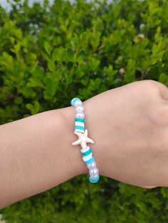 Cute blue and white combination bracelet with a starfish charm!! Beachy Bracelets, Polymer Clay Beads, Blue Bracelet, Clay Beads, Starfish, Favorite Jewelry, Jewelry Bracelets, Bathing Beauties, Accessory Gift