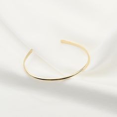 "14K gold cuff bracelet. 14K Gold Minimalist Cuff Bracelet, Delicate cuff bracelet. The bracelet will be shipped in a gift box * 14K solid gold. It is about 2.5mm width. Please select the size of your wrist. If your wrist is 6\", please purchase a 6\" bracelet. (If you order a 6\" bracelet, actual cuff length will be 5\" plus 1 inch opening.) Please read our policies before you place your order. https://www.etsy.com/shop/SashJewelry/policy?ref=shopinfo_policies_leftnav To see other Mother daught Elegant Gold Bracelet With Open Band, Adjustable Gold Cuff Bracelet For Everyday Luxury, Elegant Gold Open Band Bangle, Gold Open Band Bangle Gift, Gold Open Cuff Elegant Jewelry, Elegant Gold Open Cuff Jewelry, Elegant Cuff Bangle As A Gift, Modern Yellow Gold Bangle Cuff Bracelet, Elegant Open Cuff Bangle With Polished Finish