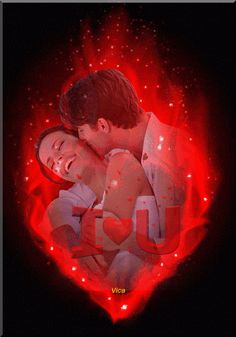 a man and woman embracing in front of a red heart with sparkles on it