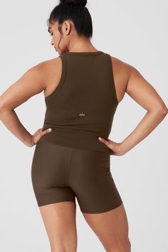 The name says it all: The Goddess Ribbed Go-To Tank fits like your best basic tank, with a racerback and cropped hem—but it’s made from a buttery-soft, ribbed performance fabric that’s perfect for practice. Layer it over a sports bra for movement, then pair it with trousers for an effortless street-style look. Sporty Bra-friendly Activewear By Alo Yoga, Sporty Ribbed Cropped Tank Top, Sporty Ribbed Scoop Neck Sports Bra, Sporty Compressive Ribbed Tank Top, Ribbed Scoop Neck Sporty Activewear, Ribbed Athleisure Tank Top For Sports, Ribbed Racerback Activewear For Workout, Medium Support Ribbed Racerback Activewear, Athleisure Ribbed Tank Top For Sports