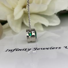 "This necklace is a lab created emerald bezel set with 18 inch diamond cut cable chain, made with pure 14k white gold #5935 -Approximate total carat weight: .80 ct. -Gem Type: Lab created emerald -Stone Shape: Round / 6MM -Stone Color: Lively rich green -Stone Clarity: VS2 -Hardness: 8.5 -Metal Type and Purity: 14k white gold -Setting: Bezel Setting: floating necklace -Chain: 18\" delicate gold chain (heavier chain is available contact us for pricing) -Clouser: Spring ring For customization plea Emerald Cut Diamond Necklace In White Gold, Silver Necklaces With Emerald Cut Birthstone, Anniversary Emerald Necklace In Sterling Silver, Anniversary Emerald Necklace In White Gold On Sterling Silver, Silver Necklace With Emerald Cut Birthstone, Silver Emerald Cut Birthstone Necklaces, White Gold Emerald Birthstone Necklace In Sterling Silver, White Gold Sterling Silver Emerald Birthstone Necklace, Sterling Silver White Gold Emerald Birthstone Necklace