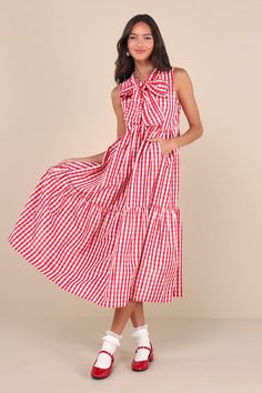 From ballet flats to cowboy boots, the Sister Jane Stables Red and White Gingham Tiered Midi Dress With Pockets is ready to be styled to perfection! A classic red gingham print adorns slightly shimmery, lightweight woven fabric as it shapes this darling dress. A ruffled, mock neckline (with a notched detail) boasts sash ties that create a bow at the center of the sleeveless bodice. High waist features curved seaming atop a tiered, A-line skirt with side seam pockets and a chic midi hem. Fit: Thi Kentucky Derby Dress, Red Gingham Dress, Red And White Gingham, Midi Dress With Pockets, Red And White Dress, Sister Jane, Derby Dress, Eve Dresses, Darling Dress