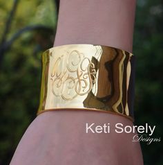 Personalized monogram bangle with hand engraved initials. Very stylish, unique gift for any women. Order in Sterling Silver, yellow gold or rose gold. Create elegant gift for woman of any age. Designs by: Keti Sorely. Metal options: - Sterling Silver - Sterling Silver with yellow gold overlay - Sterling Silver with Rose gold overlay Bracelet Width - 1.5" Engrave 1 to 3 initials. Bangle size: medium to large. One size fits all. ---------NOTE-------------- Traditional monograms are made with the f Luxury Engraved Cuff Bracelet For Anniversary, Luxury Engraved Adjustable Cuff Bracelet, Luxury Adjustable Engraved Cuff Bracelet, Engraved Cuff Bangle For Wedding, Wedding Engraved Cuff Bangle, Elegant Engraved Cuff Jewelry, Luxury Engraved Cuff Jewelry, Luxury Engraved Rose Gold Bracelet, Engraved Cuff Bracelet For Wedding