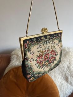 Beautiful Vintage Womens 1970s Tapestry Bag Lovely Floral Bag detail in a carpet bag style design Nice gold metal detail and clasp Cable style gold chain strap In good condition Ideal as a purse/mini bag for an evening out Very cute bag Measurements  Bag Body 7 by 6 Inch Length of bag inc strap 11.5 Inch Vintage Evening Bag In Tapestry Material, Vintage Tapestry Bag For Evening, Vintage Formal Tapestry Bag, Vintage Tapestry Bag For Formal Occasions, Vintage Tapestry Shoulder Bag For Evening, Formal Vintage Tapestry Bag, Gold Tapestry Rectangular Bag, Vintage Bags With Gold-tone Hardware, Vintage Gold Shoulder Bag