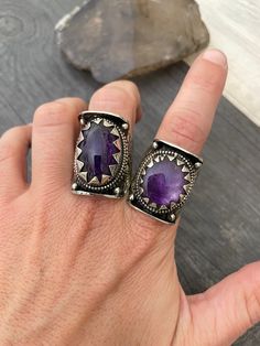 Unique unisex beautiful and powerful statement amethyst rings. They are big rings yet super comfy to wear, and easy to match other accessories and your everyday outfits. They are made with alloy metal and the Amethyst stones.  Each has a unique one of a kinds stone, thats why each ring has a number in the pictures, for you to choose your favorite one. The dimensions are in one picture with the smallest ring that is number 17 and the biggest one is number 2. All the rings will be in between this Bohemian Oval Amethyst Ring For Anniversary, Unique Oval Amethyst Ring, Spiritual Oval Purple Ring, Handmade Oval Purple Ring, Bohemian Amethyst Ring For Anniversary, Unique Purple Rings With Stone Setting, Adjustable Purple Amethyst Ring In Bohemian Style, Unique Purple Promise Ring, Handmade Open Amethyst Ring