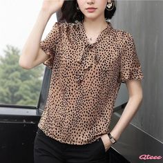 Comfortable and Cozy Short-Sleeve Blouse with Soft Silhouette Non-stretch Short Sleeve Blouse For Fall, Casual Non-stretch Blouse For Work, Casual Short Sleeve Blouse For Fall, Casual Short Sleeve Fall Blouse, Brown Short Sleeve Blouse For Fall, Casual Brown Workwear Blouse, Trendy Brown Short Sleeve Blouse, Half Shirts, Bow Print