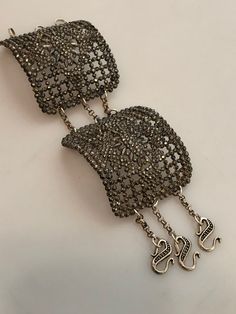 "Just purchased this double Art Deco CUT STEEL shoe Buckle Bracelet at an estate. This one is different than most of what I have seen because it was made with 2 buckles instead of one. The bracelet measures 6.5\" which includes the chain, not the hooks. You might need someone to put it on for you as it is a little tricky but once on, its very comfortable. The inside of the buckles are a little rough where the actual piece of metal was removed that held the buckle onto the shoe. Once on, however, Ornate Bracelet Jewelry For Parties, Metal Party Brooch, Handmade Evening Bracelet Jewelry, Unique Evening Bracelet Jewelry, Adjustable Handmade Bracelets For Evening, Antique Metal Bracelets For Party, Adjustable Costume Jewelry Bracelets For Evening, Silver Costume Jewelry Bracelets For Evening, Ornate Evening Bracelet Jewelry