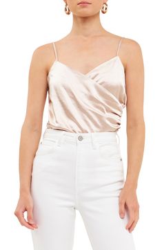 The soft glow of smooth satin enhances the after-dark romance of a delicate surplice V-neck cami. Surplice V-neck Adjustable straps 100% polyester Hand wash, dry flat Imported Satin V-neck Camisole With Delicate Straps, V-neck Satin Camisole With Delicate Straps, Satin V-neck Tank Top With Delicate Straps, Feminine Satin Cami Tank Top, Summer Satin Finish V-neck Camisole, Satin V-neck Camisole For Night Out, Summer Satin V-neck Camisole, Summer V-neck Satin Finish Camisole, V-neck Satin Camisole For Night Out