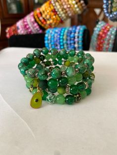 We are a small family business. Each and every single one of these bracelets have been handmade right here in our dining room with all the love and care. We have all kind of designs and colors and we can also personalize for you.  Please reach out if you want a personalize set or single bracelet. Turquoise Wrap Bracelet Great For Gifts, Casual Stackable Jewelry As Gift, Casual Stackable Round Beaded Jewelry, Beaded Wrap Bracelet For Gifts, Hand Wrapped Crystal Bracelet With Round Beads For Friendship, Spiritual Wrap Bracelet With Colorful Beads For Gifts, Unique Hand Wrapped Beaded Friendship Bracelets, Stackable Casual Beaded Bangle Bracelets, Handmade Wrap Bracelet Gift