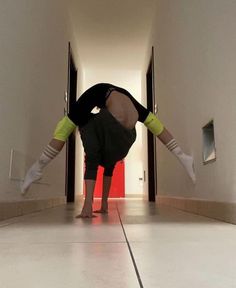 a person doing a handstand on the floor