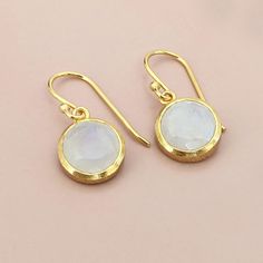 Roses Moonstone Gold Earrings 18CT Gold Vermeil on Sterling Silver GEMSTONE MOONSTONE A simply beautiful everyday earrings with a unique gemstone. Perfect to combine with other jewels from the same collection. Matte Look Soft Brushed Textured Gemstone size 10mm x 10mm GEMSTONE Moonstone also known as Rainbow Moonstone, connects us to Divine Inspiration, and channels it into our own intuition. Encourages introspection and judgment, yielding easier decision making. Note that the colour and translu Moonstone Earrings Gold, Dainty Dangle Earrings, Tusk Necklace, Double Horn Necklace, Jewellery Women, Unusual Earrings, Mens Bracelet Silver, Moonstone Earrings, Earrings Dainty