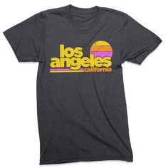 Free Shipping!! Part of our Radical States series, the Los Angeles Sunset shirt is a tribute to old school LA. A retro style and vintage inspired graphic tee printed on a very comfortable, nicely fit shirt. Heather Dark Grey vintage style tee. Men's / Women's / Unisex We use shirts and tanks from companies dedicated to ethical standards of conduct. They are child labor free and sweat shop free. The printing uses inks that are water based and eco-friendly. View our full store: https://www.etsy.co Retro Text Print T-shirt For Beach, Tri-blend Retro T-shirt For Streetwear, Retro Tri-blend T-shirt For Streetwear, Retro Beach T-shirt With Text Print, Retro Cotton T-shirt For Surfing, Retro Short Sleeve Surfing T-shirt, Retro Short Sleeve T-shirt For Surfing, Retro Pre-shrunk T-shirt For Summer, Retro Tri-blend T-shirt