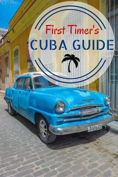 an old blue car parked in front of a building with the words first timer's cuba guide over it