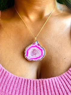 "Vivica" Experience the unique beauty of nature with this large pink geode necklace. With its bold, captivating color and stunning natural crystal formation, it is sure to make a statement and turn heads. Stand out and show off your unique style with this one-of-a-kind geode necklace! 11" Long Pendant: 2" x 1 3/4" 14k Gold-filled Chain Pink Pendant Crystal Necklace With Natural Stones, Pink Gemstone Jewelry With Mineral Crystal, Pink Agate Necklace Gift, Pink Agate Necklace For Gifts, Pink Agate Necklace For Gift, Gift Pink Agate Necklace, Unique Pink Gemstone Necklace, Pink Agate Pendant Jewelry, Unique Pink Jewelry With Large Pendant