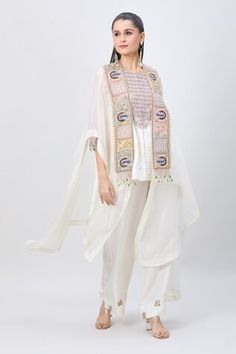 Ivory organza cape with peacock, pearl and zardozi embroidered broad border. Comes with embroidered yoke short kurta and sequin embroidered hem pant. - Aza Fashions Bohemian Off White Chanderi Kurta, Bohemian White Palazzo Set With Dupatta, White Sleeveless Traditional Wear With Resham Embroidery, White Tops With Dupatta For Festive Occasions, Bohemian Sets With Motifs, Beige Bohemian Sets With Dupatta, Bohemian Beige Set With Dupatta, Beige Bohemian Set With Dupatta, Bohemian Cream Sets With Dupatta