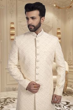 Looking for an elegant yet unique look on your wedding day? Look no further than our Mens Sherwani R14-S54! This thread-embroidered sherwani will make you stand out as the groom while showcasing a touch of quirkiness and style. Off White Naqshi Bandhgala, Designer Off-white Bandhgala For Eid, Designer Off-white Bandhgala With Resham Embroidery, Formal Off White Kurta With Cutdana, Formal Off-white Kurta With Cutdana, White Nehru Jacket With Cutdana For Reception, Designer White Nehru Jacket With Cutdana, Fitted Chikankari Embroidery Sherwani For Groom, Fitted Sherwani With Chikankari Embroidery For Groom