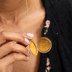 The Story A striking antique piece from the Victorian era. Created in 14 karat yellow gold, a raised mythical lion's head is the main feature of this round locket. Formed with lots of expression, two small rubies are set as the eyes with a 0.10 carat Old Mine Cut diamond set within the lion's mouth. The locket shows its age in the best possible way with the rich patina making the raised work pop and gold glow. At 1.66" tall with its bale, it's a substantial size. It holds two round photos and is Gold Medallion Locket Necklace Stamped 14k, Ceremonial 14k Gold Medallion Jewelry, Victorian Round Locket Necklace Stamped 14k, 14k Gold Medallion For Ceremonial Use, Victorian Style Yellow Gold Round Jewelry, Antique 14k Yellow Gold Locket Necklace, Antique Yellow Gold Jewelry With Coin Pendant, Heirloom Yellow Gold Medallion Locket Necklace, Antique Gold Round Jewelry With Coin Pendant