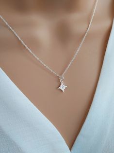 North star necklace sterling silver, Polaris starburst necklace, celestial star jewelry, silver cz diamond star necklace Shine bright with our gorgeous North Star necklace!  Handcrafted with care using a tiny sterling silver & cubic zirconia North Star charm and delicate sterling silver chain, this dainty necklace symbolises hope and inspiration.  The North Star is the anchor of the northern sky, giving guidance and direction to those who follow it. Stunning little cubic zirconia crystals mimic Polaris Star, Diamond Star Necklace, Granddaughter Necklace, North Star Necklace, Starburst Necklace, The North Star, Diamond Star, Star Jewelry, Cz Diamond