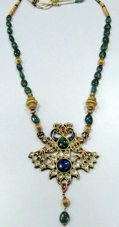 Vintage Antique 22 ct gold Peacock necklace kundan meena polki diamond necklace A genuine antique rare piece of jewel comes from the houses of Mewar,made with high calibre kundan polkee (old uncut diamonds) and genuine natural gemstones necklace (Kundan Meena choker). A beautiful peacock set with genuine gemstone absolute breathtaking piece in very good condition strung with emerald and gold beads fully handmade one of a type with very elobrate enamel work at the back. Could be worn either side. 22k Gold Pendant Jewelry For Festivals, 22k Gold Kundan Pendant Necklace For Diwali, Ornate 22k Gold Pendant Jewelry, Heavy 22k Gold Pendant Jewelry, Antique 22k Gold Meenakari Jewelry, Festival Kundan Yellow Gold Jewelry, Yellow Gold Kundan Jewelry For Festivals, Kundan Yellow Gold Jewelry For Festivals, Ornate Meenakari Pendant Jewelry