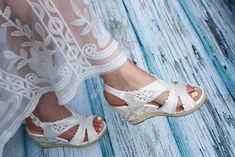 Wedge Wedding Shoes, Bridal Espadrilles, Wedding Boho Beautiful spanish Espadrilles with wedges for brides Lace Espadrilles Wedding shoes Bridal These ivory wedge wedding shoes, adorned with ivory lace overlay are the perfect accessory for a romantic wedding boho. Elegant yet oh-so comfortable, women's espadrille wedge was made with love. The accent of elegance and sophistication of the product has been designed to give your wedding day a very special accent. The shoes are specially made only us Lace-up Espadrille Wedge Sandals For Summer, White Lace-up Wedge Sandals For The Beach, White Espadrille-style High Heel Wedge Sandals, White Lace-up Espadrilles With Woven Sole, Casual Lace-up Wedge Sandals With Woven Sole, Lace Espadrilles, Spanish Espadrilles, Wedding G, Womens Espadrilles Wedges