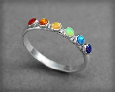 Multi Opal Ring - (choose # of opals) – LE Jewelry Designs Adjustable Rainbow Gemstone Ring, Rainbow Ring Jewelry For Wedding, Adjustable Opal Ring With Round Stone, Silver Opal Stackable Rings As Gift, Nickel-free Sterling Silver Promise Ring, Silver Multi-stone Opal Ring As Gift, Sterling Silver Spiritual Opal Ring, Adjustable Opal Birthstone Jewelry, Sterling Silver Opal Ring Gift