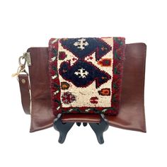 This Hand-Crafted Tirsheh Handcraft Wristlet/Clutch Bag Is A Unique Item Made Of Leather And A 70 Year Old Hand-Woven Persian Rug. Its Bohemian Design Make It Perfect For A Casual, Festival Or Travel Occasions. The Bag Features A Magnetic Closure And A Width Of 10.5 Inches And A Height Of 8 Inches. The Strap Is Made Of Brown Leather And Accented With Gold Hardware, The Handle Attaches Via A Large Lobster Clasp And Can Be Removed To Convert Into A Clutch. New With Tags. Clutch Bags With Wrist Strap As Gifts, Rectangular Leather Clutch, Multicolor Leather Rectangular Clutch, Rectangular Clutch With Leather Handles For Travel, Multicolor Rectangular Leather Clutch, Leather Handle Pouch Clutch For Travel, Leather Handheld Bag With Wrist Strap, Square Clutch With Detachable Handle For Travel, Square Travel Clutch With Detachable Handle