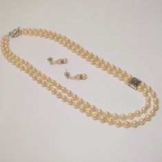 "This Swarovski 6mm pearl is combined with a 3mm Swarovski \"Golden Shadow\" crystal. The shorter strand measures 20\" and the longer is 21\". I have used a metal connector with a matching Swarovski crystal chaton. It all comes together with a pewter double toggle.   The earrings dangle on sterling silver posts at 1\" and match the necklace perfectly." Golden Shadow, Bridal Pearl Necklace, Double Necklace, Pearl Necklace Wedding, Double Strand Necklace, Bridesmaid Necklace, Wedding Jewellery Necklace, Black Jewelry, Vintage Pearls