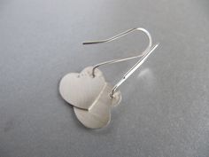 "These earrings are perfect for Valentine's day or any or any gift occasion. I cut the hearts out of sterling silver sheet with my little saw and gave them a soft brushed surface. The ear wires are handmade of sterling silver with a little ball at the end which shows at the front of the heart. Simple, elegant, and sweet. The hearts measure approx. 5/8\" by 5/8\" (16mm by 16mm)" Sterling Silver Earrings For Anniversary, Minimalist Sterling Silver Heart Earrings For Wedding, Sterling Silver Earrings For Mother's Day Anniversary, Sterling Silver Earrings For Anniversary And Mother's Day, Silver Heart Earrings For Anniversary On Valentine's Day, Sterling Silver Earrings For Anniversary Gift, Silver Sterling Silver Earrings For Anniversary Gift, Silver Heart Earrings For Anniversary Gift, Silver Heart Earrings For Anniversary