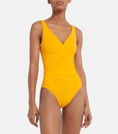 Ruched swimsuit in yellow - Karla Colletto | Mytheresa Fitted V-neck Swimwear With Twist Front, Fitted V-neck Polyamide Swimwear, Elastane V-neck Swimwear For Poolside, Fitted V-neck Swimwear In Polyamide, Summer Pool Swimwear With Crossover Waistband, Summer Swimwear With Crossover Waistband For Pool, Twist Front V-neck Swimwear, Fitted Ruched Swimwear For Sunbathing, V-neck Twist Front Swimwear For Poolside