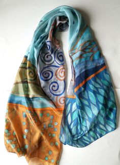 A new hand painted silk scarf in blue brown color harmony. Decorative hand painted long scarf. Klimt inspired shawl, Klimt motives, Designer silk scarf painted in swirls, leaves and plants motives. Evening Blue Brown shawl in Art deco style. Luxury gift for teacher, Gift for art lover woman Birthday gift for mom, for sister, Mother in low gift ♥ size is 35 by 70 inches This beautiful Rusty blue scarf is painted on pure silk pongee 5 A silk scarf will give a perfect finishing touch to any outfit, Artistic Blue Silk Scarves, Blue Hand Painted Silk Scarf, Bohemian Blue Hand Painted Silk Scarf, Blue Hand Painted Bohemian Silk Scarf, Blue Bohemian Hand Painted Silk Scarf, Artistic Blue Silk Scarf, Artsy Blue Art For Collection, Brown Shawl, Designer Silk Scarves