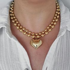 "This eye-catching statement necklace has a large puffy heart pendant on a thick gold filled ball chain. The whole piece is made of 18K gold filled brass, which looks almost like 18K solid gold. You can mix and match this necklace with your other gold or gold plated necklaces for a chic look.  This necklace can be sold separately or as a set with another 6 mm plain ball chain. The two chains complement each other and create a layered effect. The set is also available for purchase. MATERIALS: - 1 Chunky Heart-shaped Gold Jewelry, Chunky Heart Shaped Gold Jewelry, Gold Chunky Heart-shaped Jewelry, Chunky Heart Pendant Necklace For Valentine's Day, Chunky Heart Necklace For Valentine's Day, Chunky Heart-shaped Gold Necklace, Gold Chunky Heart Necklace, Chunky Gold Heart Necklace, Gold Ball Chain