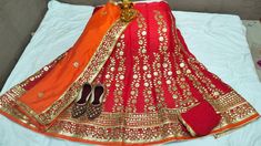 "Thank you very much for visiting my shop. Material-Pure Chinon Lehenga with Heavy Aari work Gota Patti Lace Border Lengha Dupatta - Chinon Dupatta with Gota Patti Work Accompanied with unstitched blouse piece Blouse- chion fabric  Blouse - Running Blouse Blouse length: 0.80 mtrs Waist Size : 42 Lenght  42 Note : WE ARE GIVEN FREE Rajasthani jhutti We are having expert staff in stitching .We are also take orders for dance performance, stage performance, marriage party, theme dresses, and any other demand etc.    Easy to wear and very comfortable  *Fancy Juti free free free*  PLEASE SHARE YOUR JUTTI SIZE IN MESSAGE ONLY              It Gracefully Add Style To Your Attire & Match With Your Confidence Disclaimer: Colors may slightly vary due to Photographic effects IMPORTANT NOTE : Please Be Art Silk Sharara With Gota Work For Navratri, Navratri Art Silk Sharara With Gota Work, Chinon Sharara With Gota Work For Navratri, Traditional Floor-length Sharara With Gota Work, Bollywood Style Anarkali Set For Diwali Festive, Bollywood Style Festive Anarkali Set For Diwali, Anarkali Traditional Wear With Dori Work For Festive Occasion, Festive Anarkali With Dori Work, Traditional Floor-length Gota Work Sharara