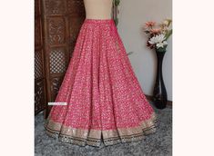 Made to Order/Made to Measurement/Custom Made Indian Lehenga Skirt (PLEASE NOTE THIS IS SKIRT ONLY) - Fabric: Embroidered Silk - Color : Hot Pink - Fully Flared Paneled (kalidaar) skirt  - Lined - Can Can attached - Embroidered Border - Drawstring with beautiful  latkan This is Made To Order and we require following measurements in inches. 1. Waist of Skirt 2. Length of Skirt PLEASE NOTE: BUYERS ARE RESPONSIBLE FOR ANY CUSTOMS AND IMPORT TAXES THAT MAY APPLY. Fabric Care : Dry Clean Only Disclai Festive Resham Embroidery Skirt, Reception Skirt With Resham Embroidery In Traditional Drape, Designer Traditional Drape Skirt With Resham Embroidery, Reception Skirt With Resham Embroidery And Traditional Drape, Traditional Drape Skirt With Resham Embroidery For Reception, Reception Skirt With Resham Embroidery, Semi-stitched, Semi-stitched Skirt With Resham Embroidery For Reception, Semi-stitched Skirt With Resham Embroidery For Wedding, Elegant Designer Skirt With Resham Embroidery