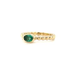 Our new beaded band ring is set with a beautiful oval 5x3 Emerald. The perfect sweet size to stack or wear every day. We set this stone in a sold gold bezel with an open bottom that allows the light to come in. There's a sizing bar at the bottom that allow us to make easy changes to the size without ruining the integrity of the beads. You'll love this new ring! 14K yellow gold 5x3 Oval Emerald Ring sizes 5-8 Beaded band design Classic Oval Stackable Rings With Bezel Setting, Dainty Oval Stackable Birthstone Ring, Oval Stackable Birthstone Ring In Fine Jewelry Style, Oval Birthstone Stackable Ring In Fine Jewelry Style, Yellow Gold Oval Birthstone Ring Stackable, Yellow Gold Oval Stackable Rings, Elegant Oval Stackable Emerald Ring, Elegant Oval Emerald Stackable Ring, Classic Oval Stackable Emerald Ring