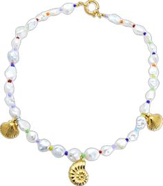 a bracelet with shell charms and pearls on it's end, in gold tone