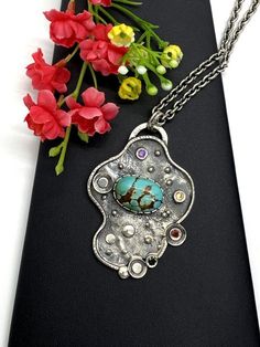 ARTISAN ROYSTON TURQUOISE PENDANT comes with 20" chain  Hand-made Sterling Silver 925.  Stones used: Royston Turquoise, Green Tourmaline,  Sapphire, Amethyst.  Height -2 1/2” (with bail), Width – 1 3/4”  Height – 62mm, width-45mm.Unique Handcrafted One-of a-kind Design Pendant.Each Piece of Jewelry in my Collection is Absolutely One of a Kind!When you start wearing a piece of my jewelry you will fall in love with it more and more each day and feel that good Energy and Love that I pass into it wh Silver Turquoise Bohemian Necklace As Gift, Silver Bohemian Turquoise Necklace Gift, Bohemian Silver Turquoise Necklace As Gift, Unique Turquoise Nickel-free Necklace, Blue Turquoise Necklace With Oxidized Finish As Gift, Bohemian Sterling Silver Turquoise Necklace Gift, Unique Silver Turquoise Necklace, Bohemian Turquoise Necklace In Sterling Silver, Gift Turquoise Necklace With Oxidized Finish