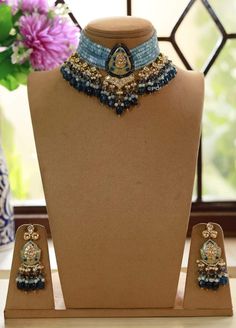 Kundan choker necklace with matching earrings Perfect for any kind of occasions and ceremonies. You can wear it with Saree lehenga and Evening Gowns. Highest quality and craftsmanship. Arrives in box Please let me know if you have any questions Blue Kundan Necklace For Reception Festivities, Blue Kundan Necklace For Festive Reception, Blue Kundan Necklace For Reception And Festive Occasions, Blue Jewelry For Reception And Festivals, Blue Kundan Necklace For Reception, Blue Bollywood Jewelry For Reception, Blue Chandbali Jewelry With Cutdana Detail, Blue Chandbali Jewelry With Cutdana, Blue Kundan Necklaces For Reception