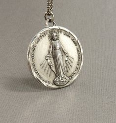 Check out this item in my Etsy shop https://www.etsy.com/listing/690111074/lrg-vintage-sterling-immaculate-mary Vintage Nickel Free Necklaces For Commemoration, Personalized Vintage Jewelry For Commemoration, Collectible Jewelry With Miraculous Medal Round Pendant, Vintage Charm Necklaces For Commemoration, Vintage Charm Necklace For Commemoration, Vintage Charms Necklace For Commemoration, Collectible Round Miraculous Medal Jewelry, Vintage Round Necklace With Miraculous Medal, Mary Necklace Silver