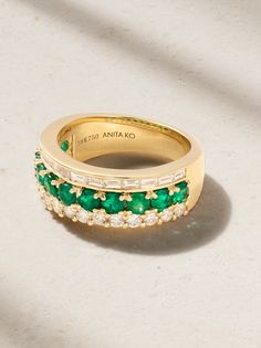 Anita Ko's ring is set with a row of emeralds sandwiched between baguette- and round-cut diamonds - it creates a cool stacked look without any effort. It's cast from 18-karat gold and looks especially chic against a bold red manicure. Luxury Yellow Gold Emerald Ring With Single Cut Diamonds, Timeless Green Jewelry With Baguette Diamonds, Luxury Emerald Ring With Single Cut Diamonds For Anniversary, Luxury Channel Set Emerald Ring For Anniversary, Luxury Formal Emerald Ring With Channel Set, Luxury Channel Set Emerald Ring For Wedding, Luxury Channel Set Emerald Ring For Formal Occasions, Elegant Yellow Gold Emerald Ring With Channel Set, Luxury Yellow Gold Emerald Baguette Cut Ring