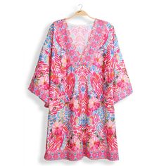 Floral Print Summer Cover-Up Keep your style fresh with this colorful cover-up dress! Perfect for summer, this floral print dress will add a touch of fun to any outfit. Plus, it's lightweight and comfortable, making it a convenient choice for all your warm-weather adventures. Show off your playful side with this must-have addition to your wardrobe.Floral Patterned Design - 30% Cotton, 70 Polyester - Perfect for Summer Beach/Vacation **Size- One Size Fits All** Flowy V-neck Beach Dress With Tropical Print, Beachy Floral Print Sundress For Beach Cover-up, Beachy Floral Sundress For Beach Cover-up, Tropical V-neck Beach Dress For Spring, Tropical V-neck Beach Dress For Summer, Colorful V-neck Vacation Dress, Tropical V-neck Sundress For Spring, Beachy V-neck Floral Print Beach Dress, Printed Beach Dress For Spring Cover-up