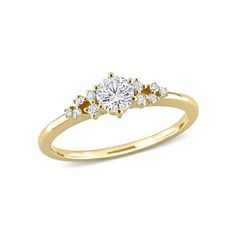 a yellow gold engagement ring with three diamonds on the top and side stones in the middle