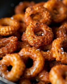 a pile of fried onion rings sitting on top of a table