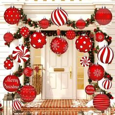 christmas decorations on the front door of a house with red and white ornaments hanging from it