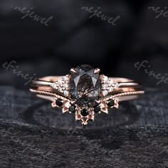 an engagement ring with a fancy brown diamond and black diamonds on the band, set in 18k rose gold