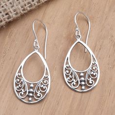 Designed by Balinese artisan Yuniati these earrings are meant for everyday wear but you can dress them up for an evening out too. The artisan hand crafts a delicate pear-shaped frame from sterling silver filling the interior with curling tendrils of silver she polishes for a shining finish. Elegant Sterling Silver Earrings For Festivals, Artisan Teardrop Earrings For Pierced Ears As Gift, Artisan Teardrop Earrings As Gift, Elegant Sterling Silver Danglers For Festivals, Elegant Sterling Silver Danglers For Gift, Elegant Sterling Silver Danglers As Gift, Traditional Teardrop Earrings For Gift, Traditional Teardrop Earrings As A Gift, Handmade Ornate Teardrop Earrings