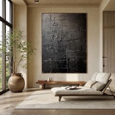 a living room with a large painting on the wall