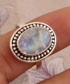 #Mother's Day gift itemsNatural Rainbow Moonstone Ring-Blue Fire Moonstone Ring-Handmade Silver Ring-925 Sterling Silver-Gift for her-Promise Ring-Anniversary Ring This One of a kind ring is adorned with beautiful rich Rainbow Moonstone Gemstone set in sterling silver band. Rainbow moonstone is associated with various Moon Goddesses .Moonstone has a very strong connection to the spiritual world. It has great nurturing energy which will give ease and guide in difficult times especially in issues Moon Goddesses, Spiritual World, Middle Finger Ring, Rainbow Moonstone Ring, Difficult Times, Ring Blue, Blue Fire, Silver Rings Handmade, Silver Gifts